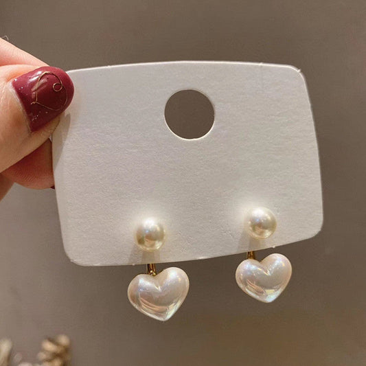 Heart-shaped pearl earrings